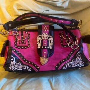 Small pink blingy leather purse.   Has never been carried.